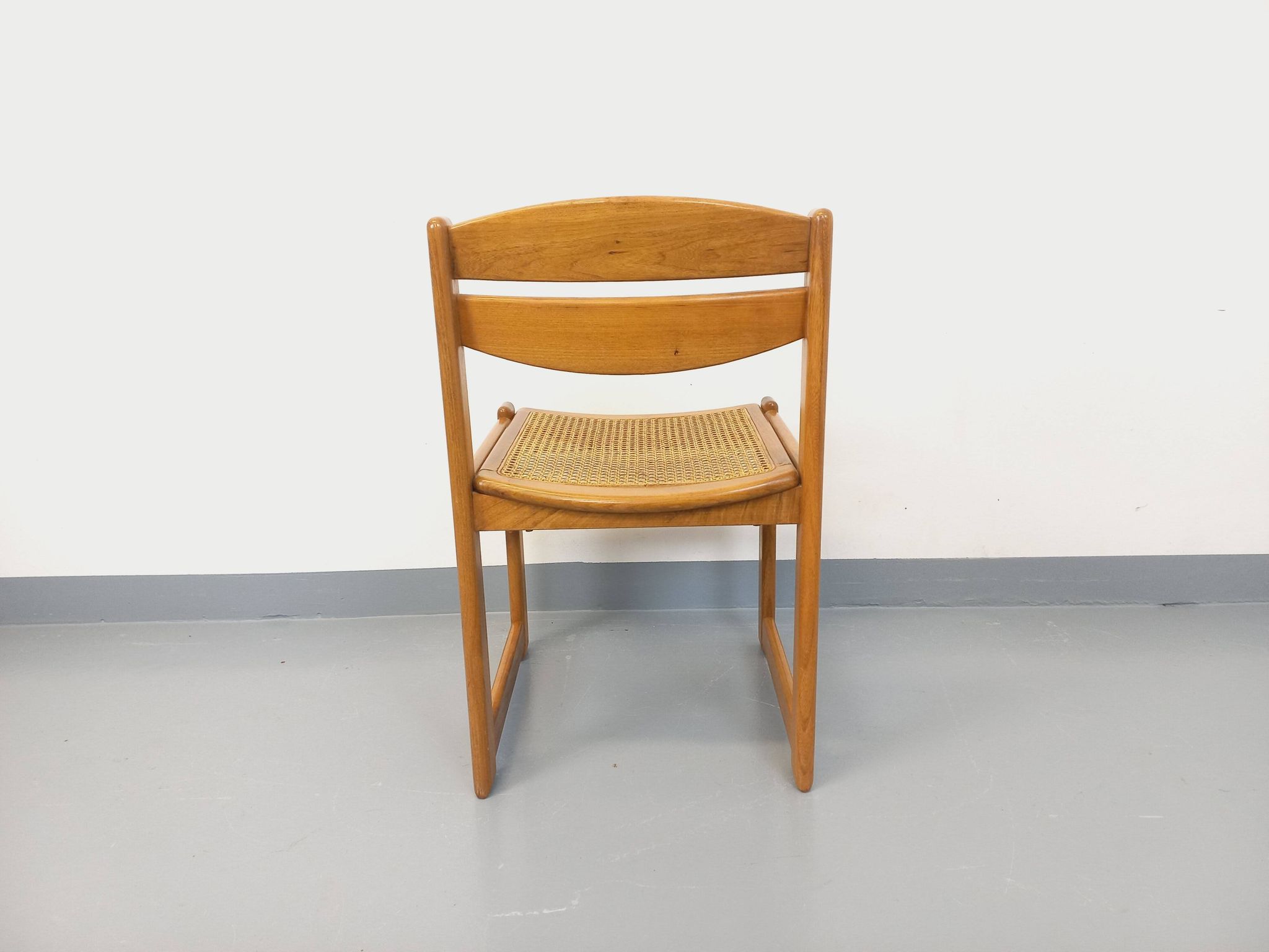 Vintage sleigh chair in beech wood and cane from the 70s and 80s