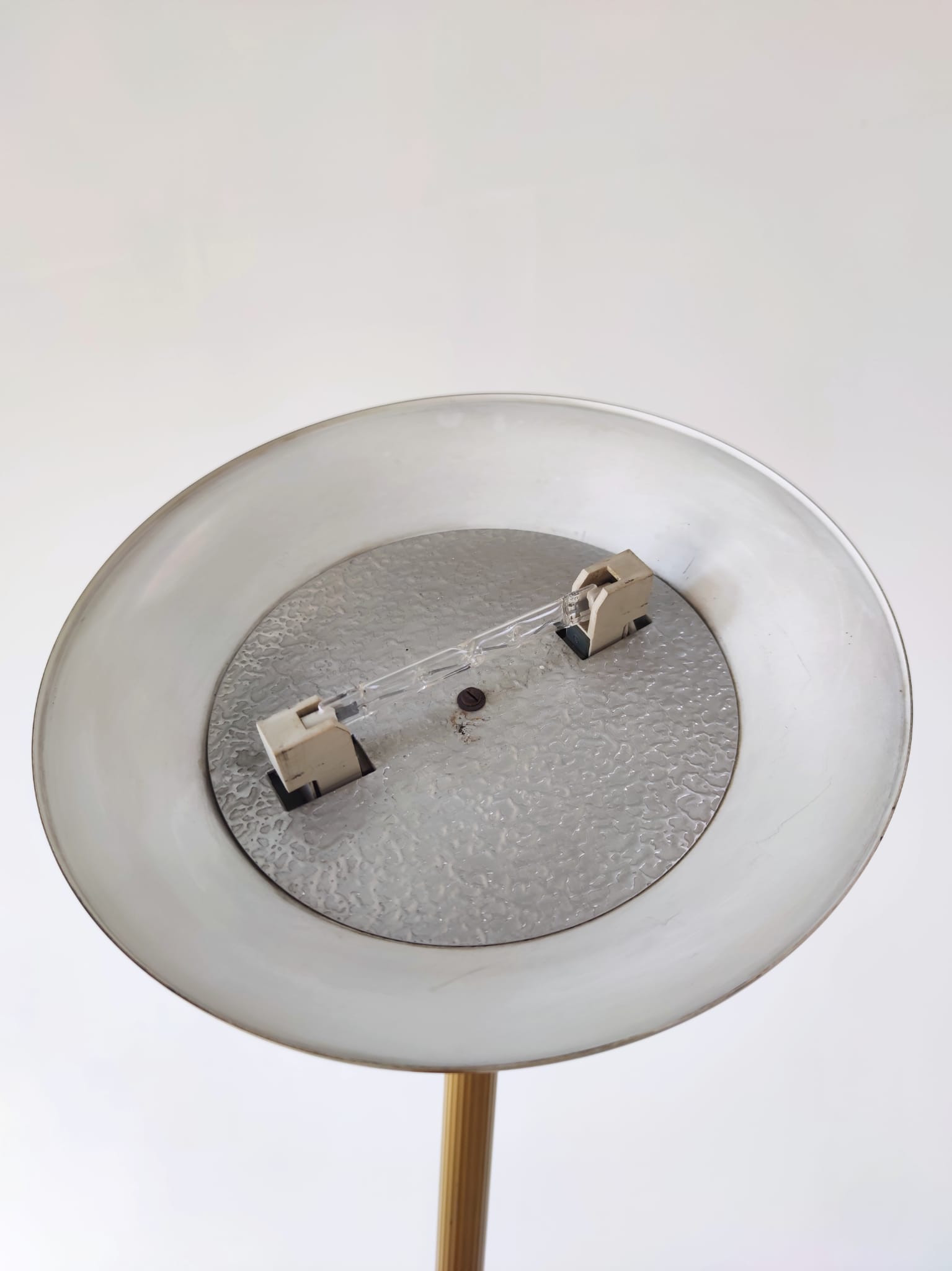 Halogen floor lamp in golden brass