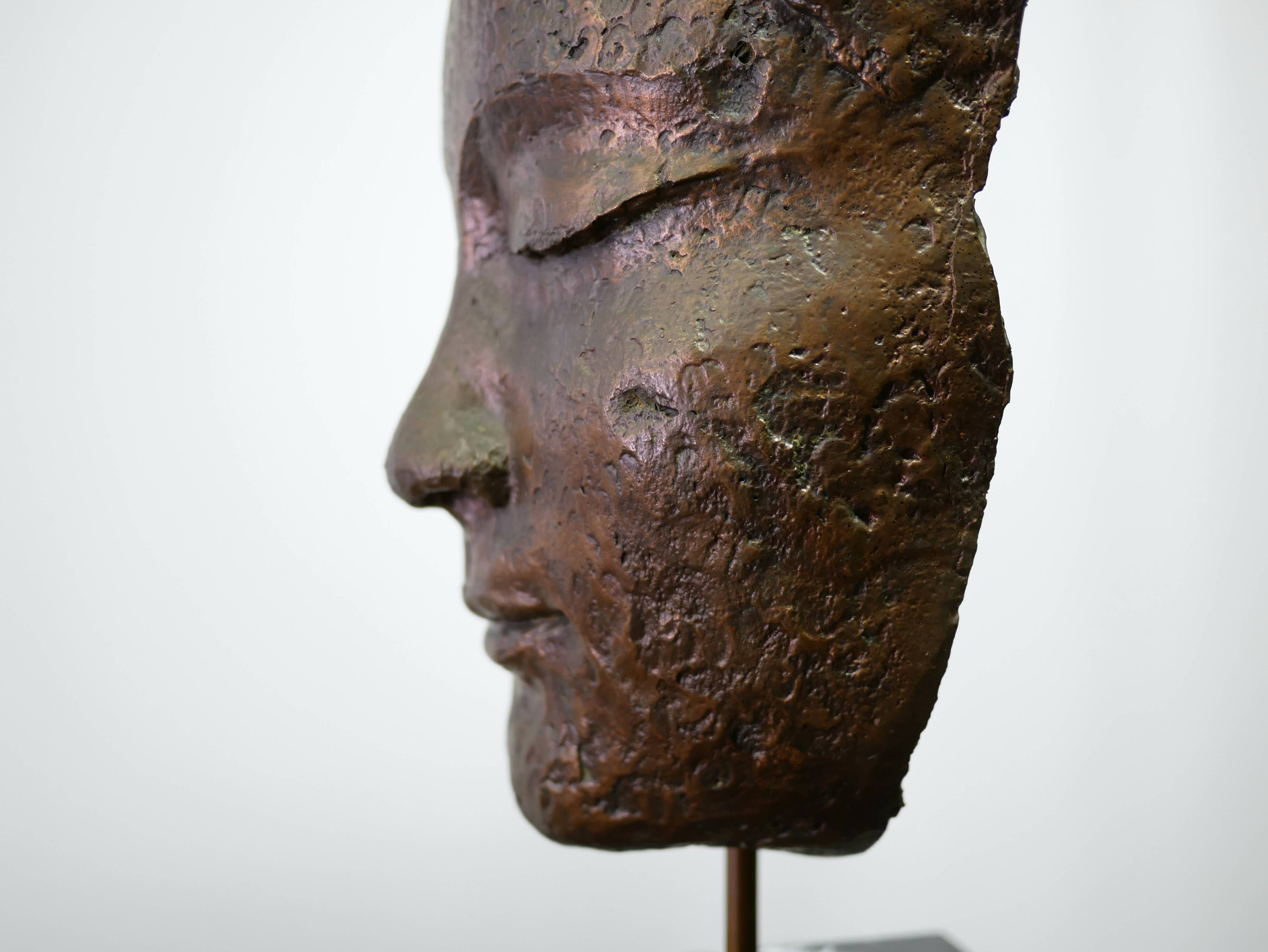 Buddha head sculpture, marble base
