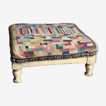 Embroidered footrest, small wooden stool