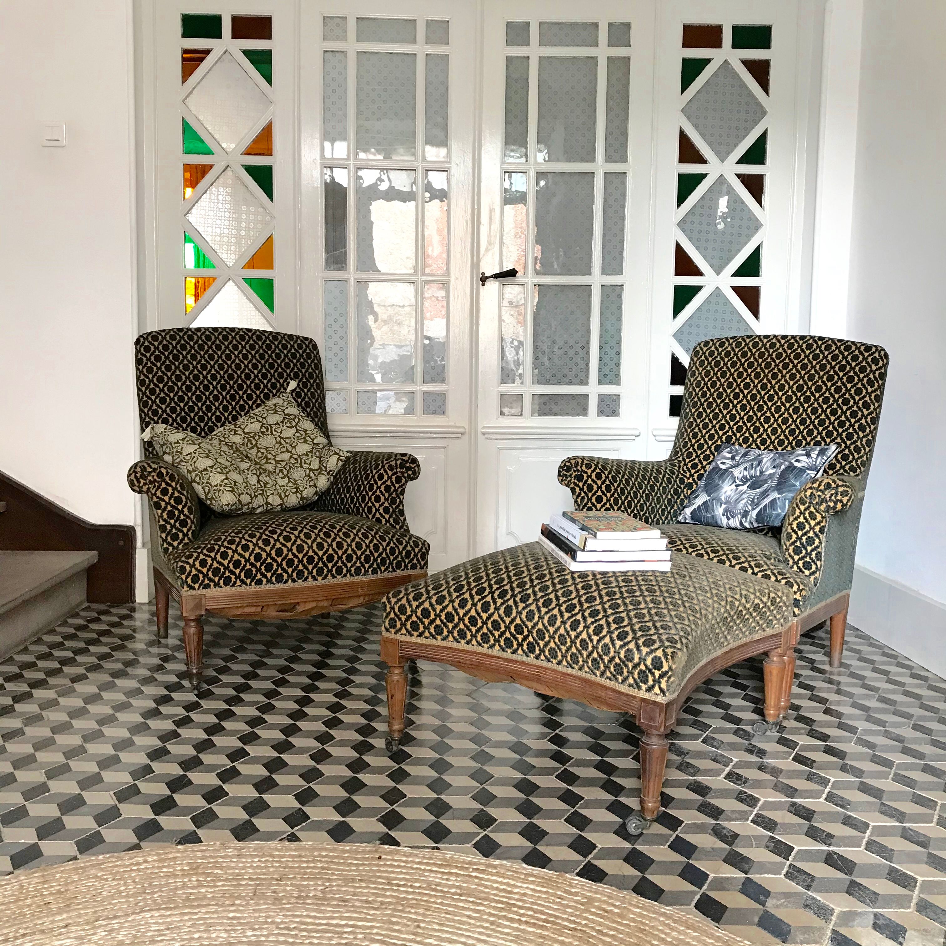 Vintage armchairs and rests feet