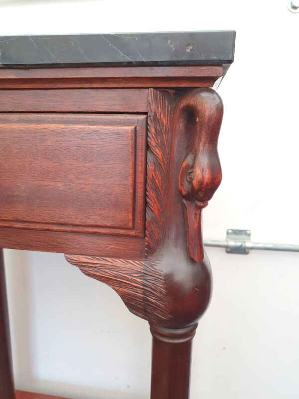 Bedside on black marble swan head