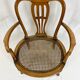 Fauteuil bas anglais en bois ajouré à assise cannée, 19e siècle