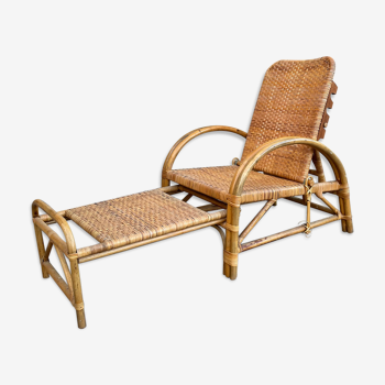 Vintage armchair and rattan ottoman