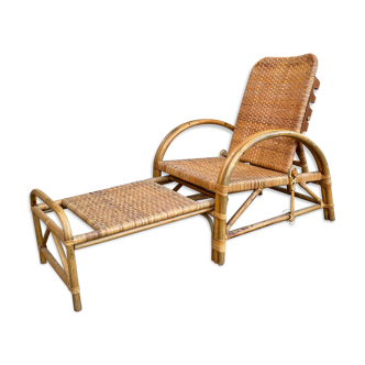 Vintage armchair and rattan ottoman