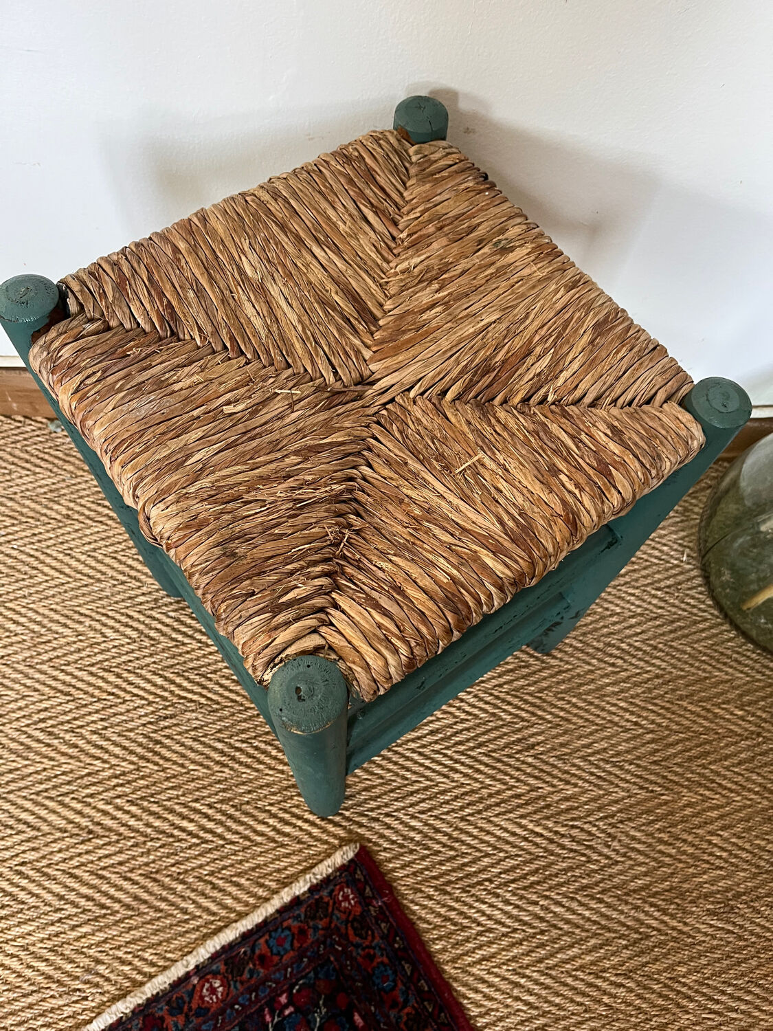 Vintage stool in green patinated wood and straw