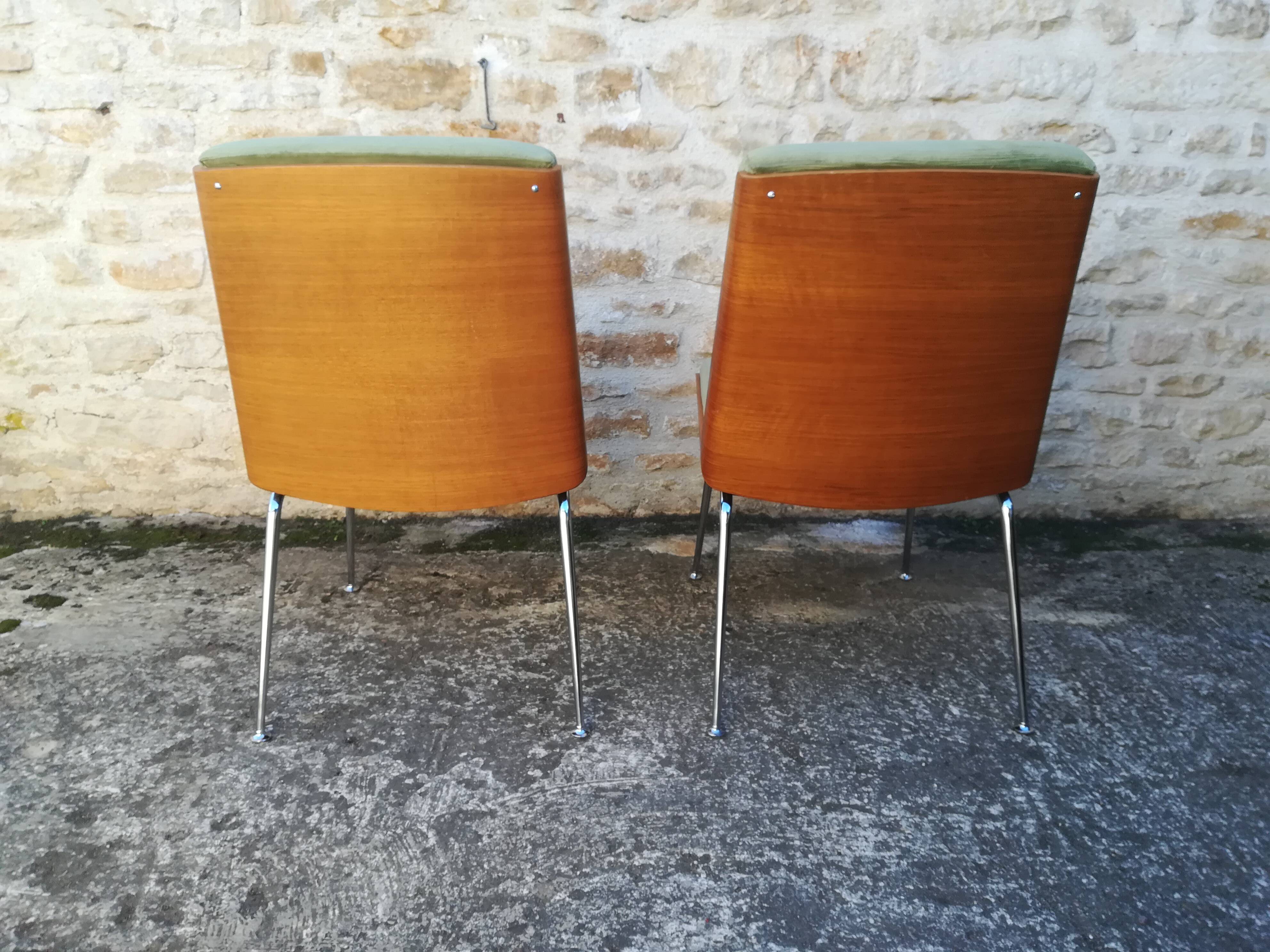 Shell chairs and green fabric
