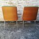 Shell chairs and green fabric