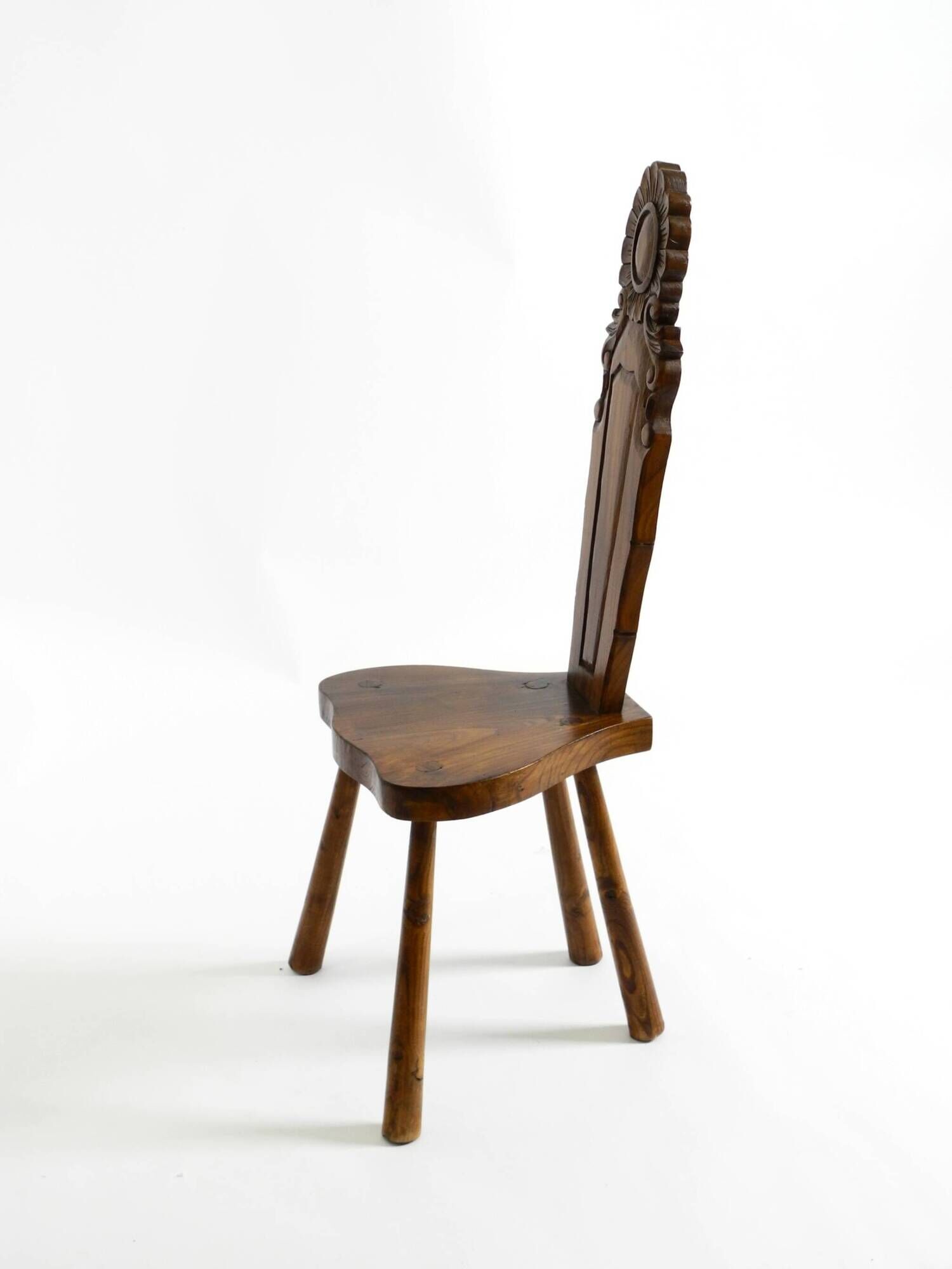 Solid wood chair with an ornate, hand-carved backrest – Made in Spain