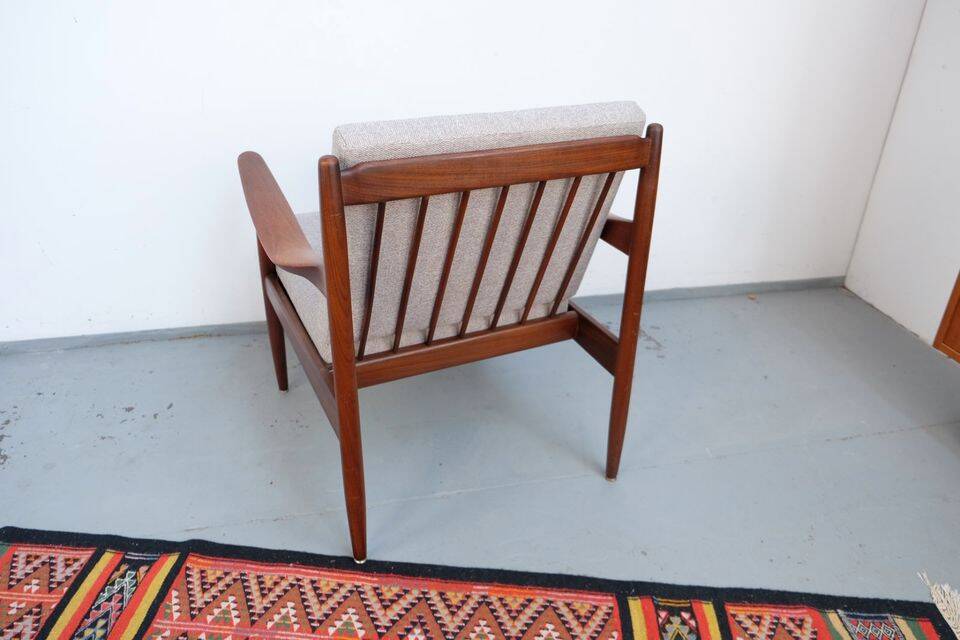 Vintage teak lounge chair, retro 1960s–70s style.