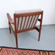 Vintage teak lounge chair, retro 1960s–70s style.