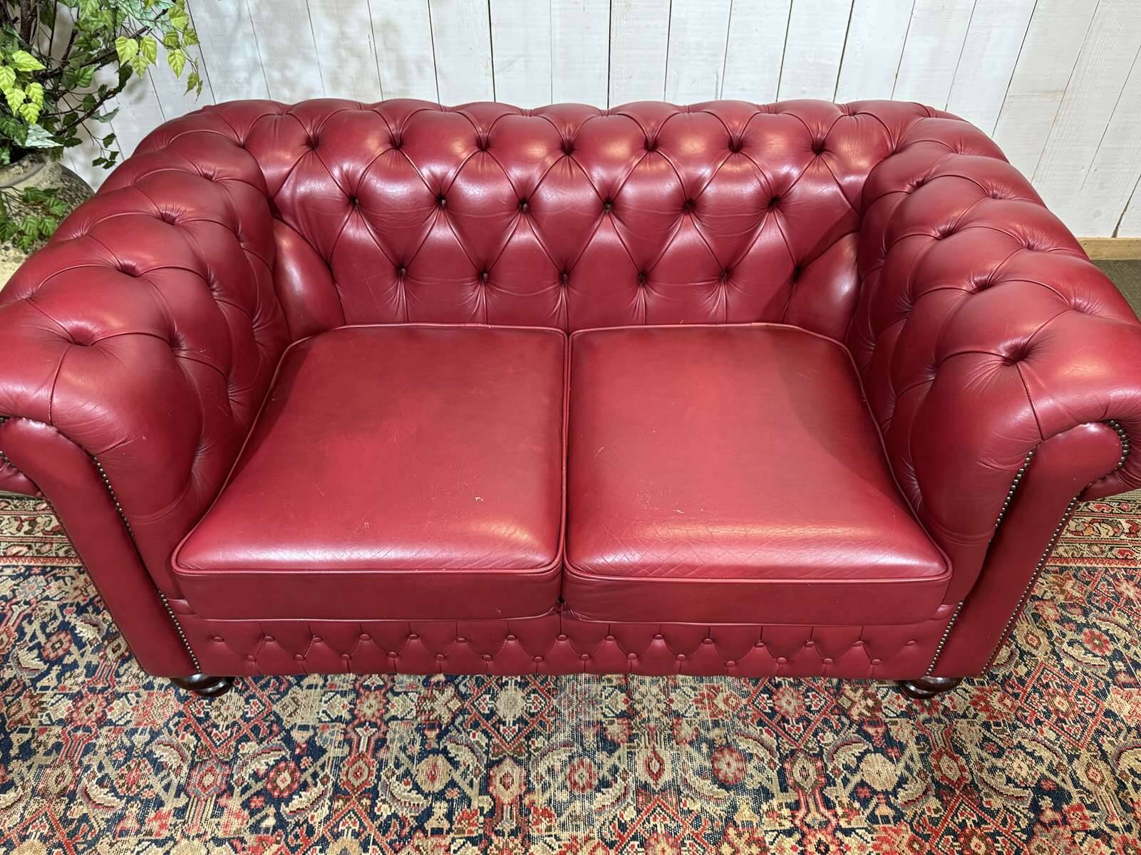 Chesterfield 2-seater leather sofa, modern production from the 2000s.