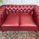 Chesterfield 2-seater leather sofa, modern production from the 2000s.