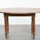 Antique English drop-leaf dining table made of walnut with elegant legs