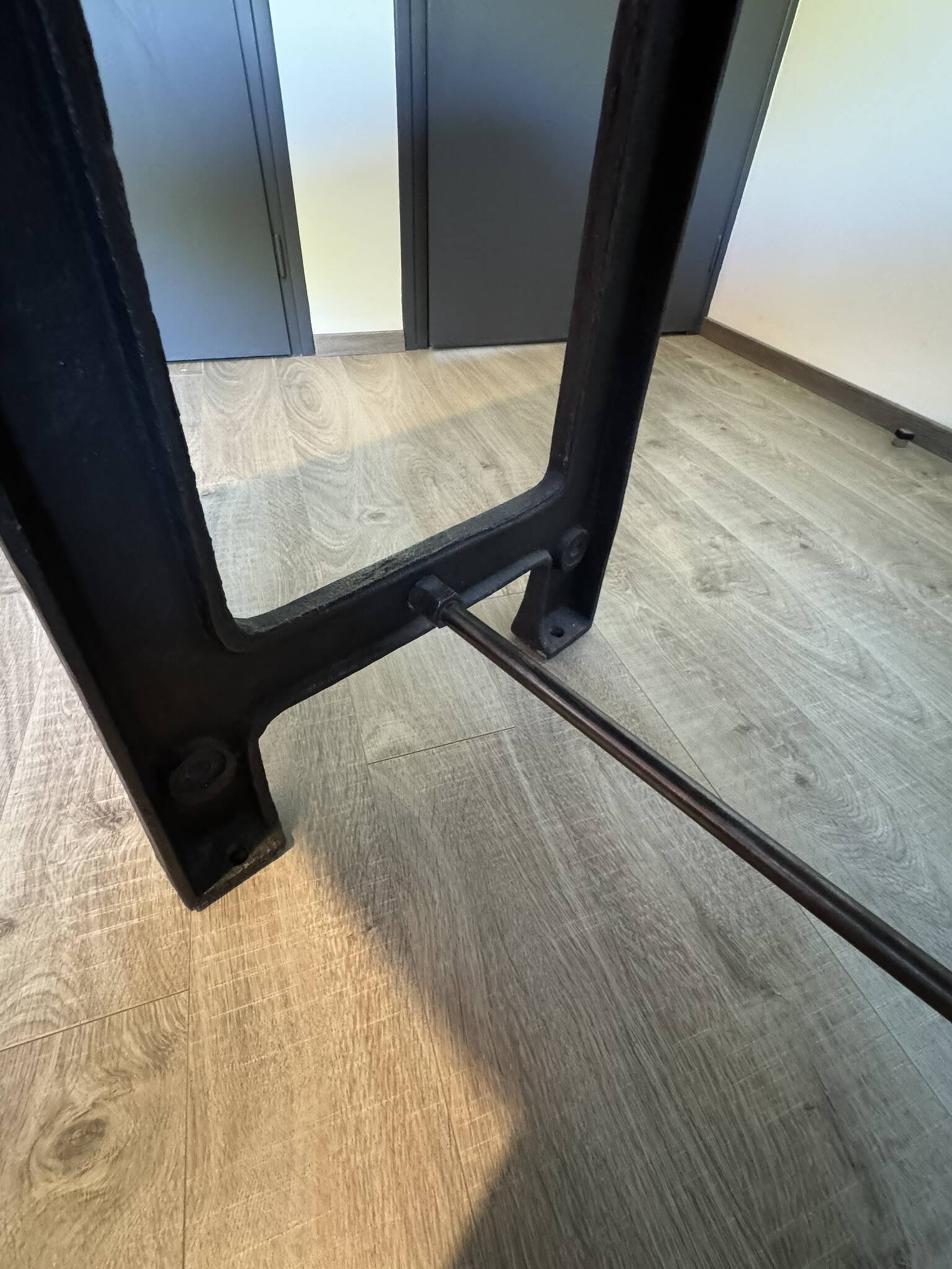 Industrial style table with a mahogany top.