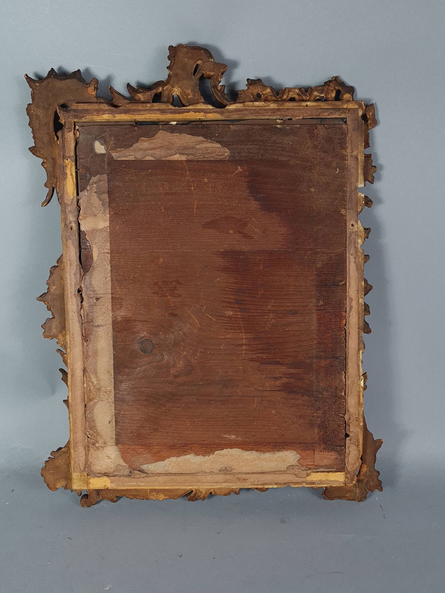 Mirror circa 1800, carved and gilded wooden frame, rocaille decoration, 54x39 cm, C227