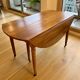 Extendable round table in solid walnut, 125cm in diameter, 5 extensions.