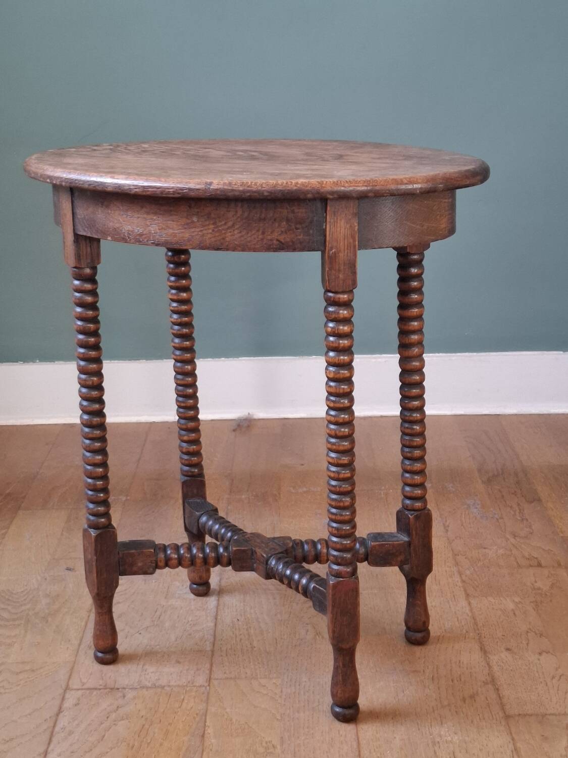 Candle holder side table with spool legs