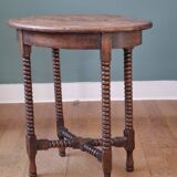 Candle holder side table with spool legs