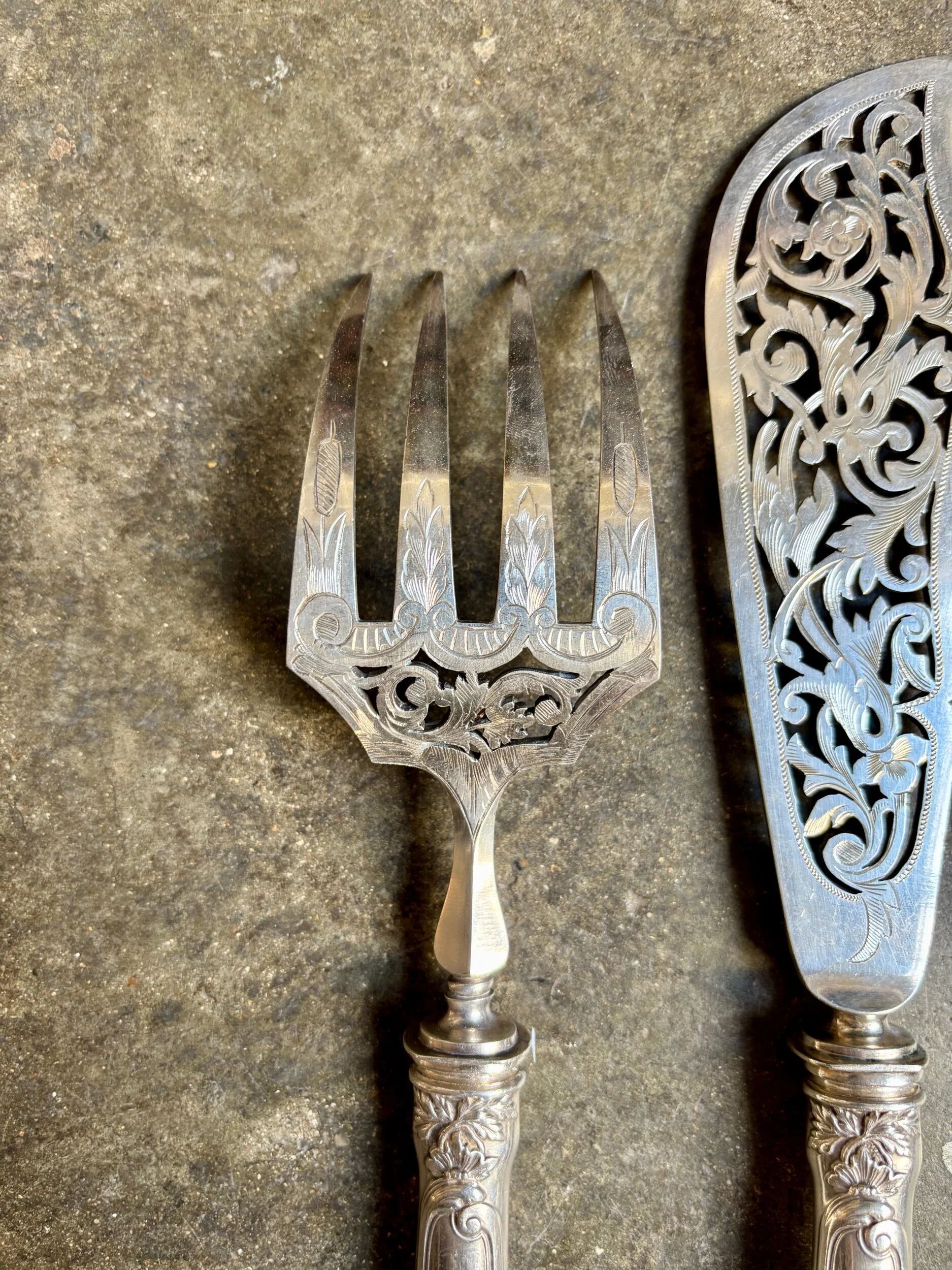 2 silver openwork service cutlery sets engraved with "AS"