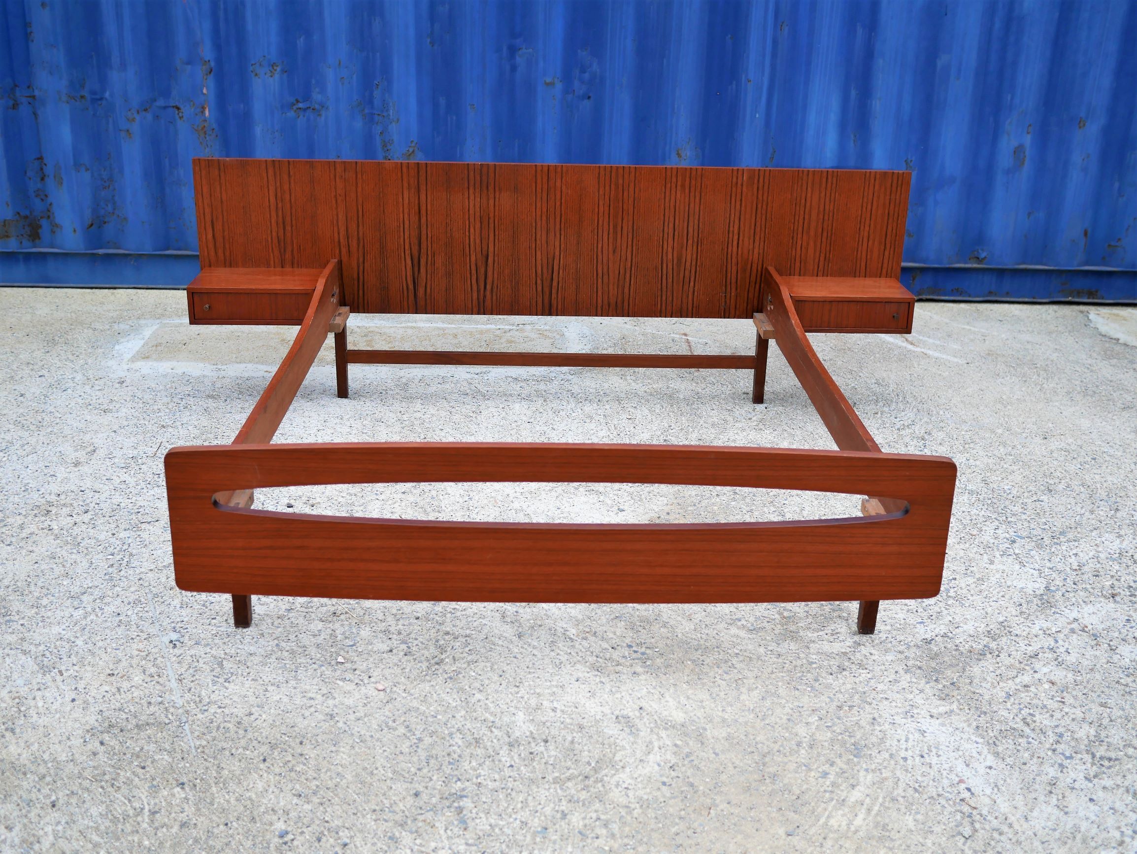 Teak bed with hanging bedside tables from the 60s