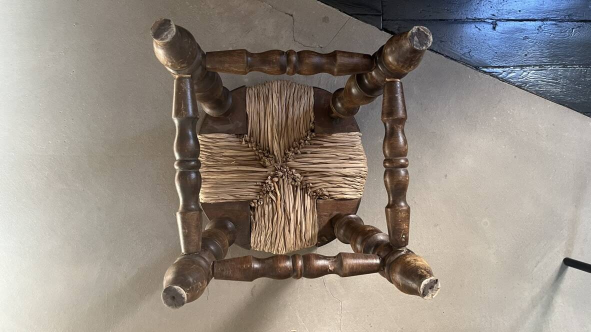 Rustic stool made of straw and wood