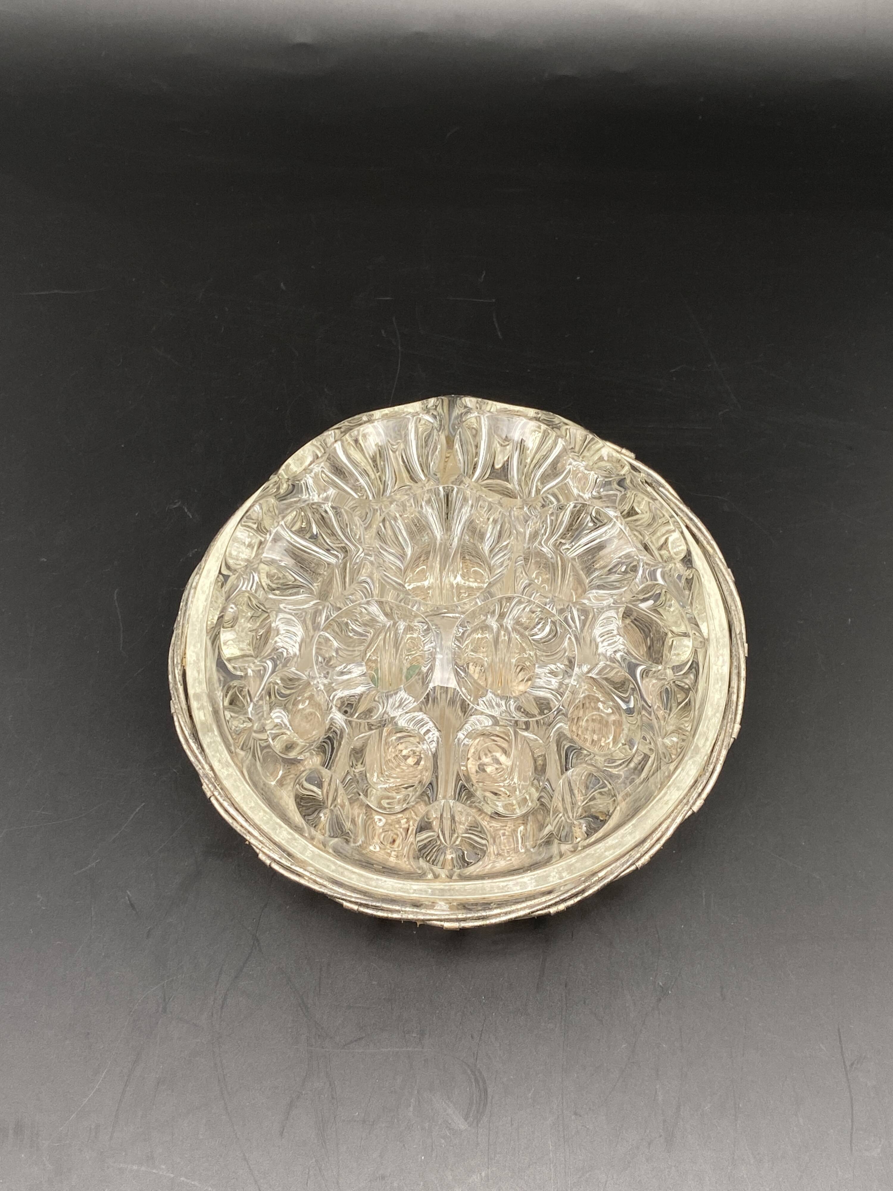 Glass flower stand with woven metal support