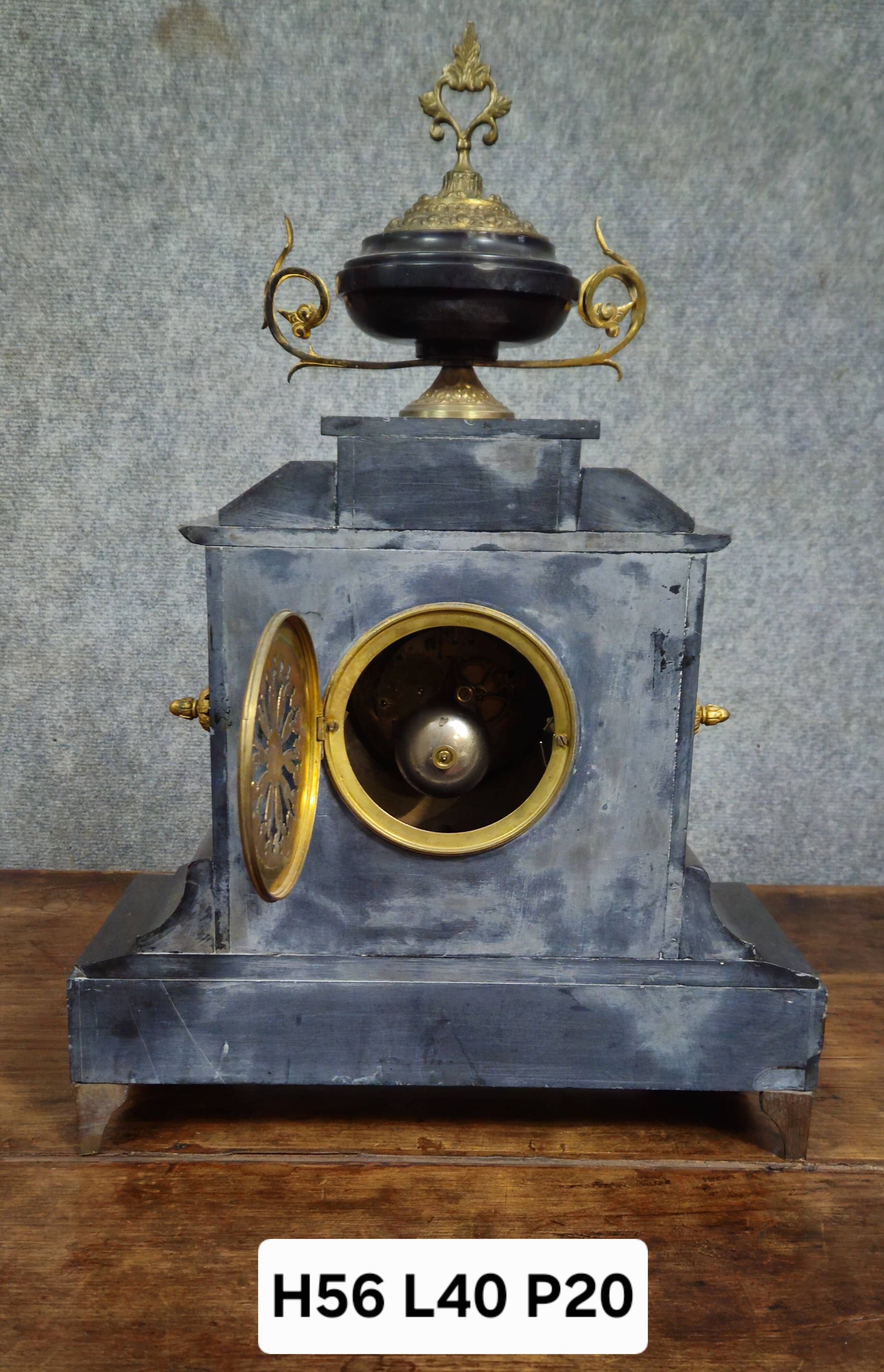 Large notary clock in black marble and gilded bronze.