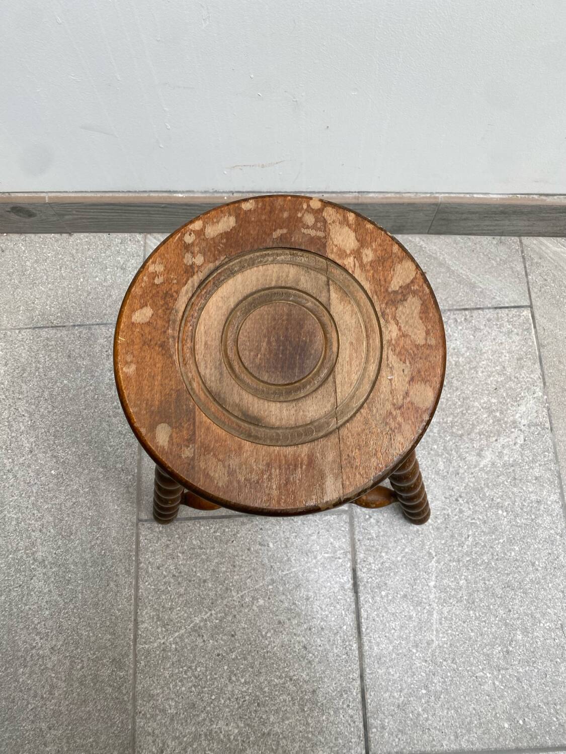 Wooden tripod farm stool