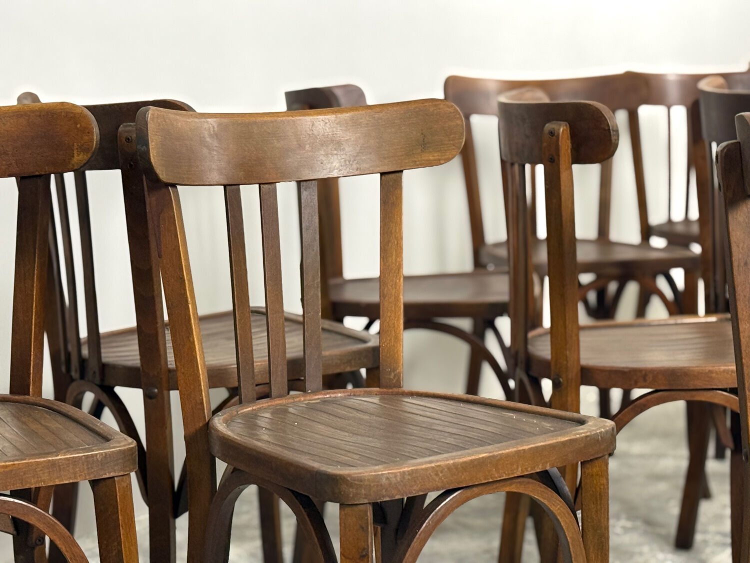 Set of 17 vintage bistro chairs in curved wood — striped seat, be