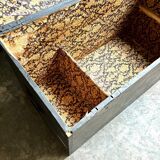 Trunk, black wooden chest and wallpaper