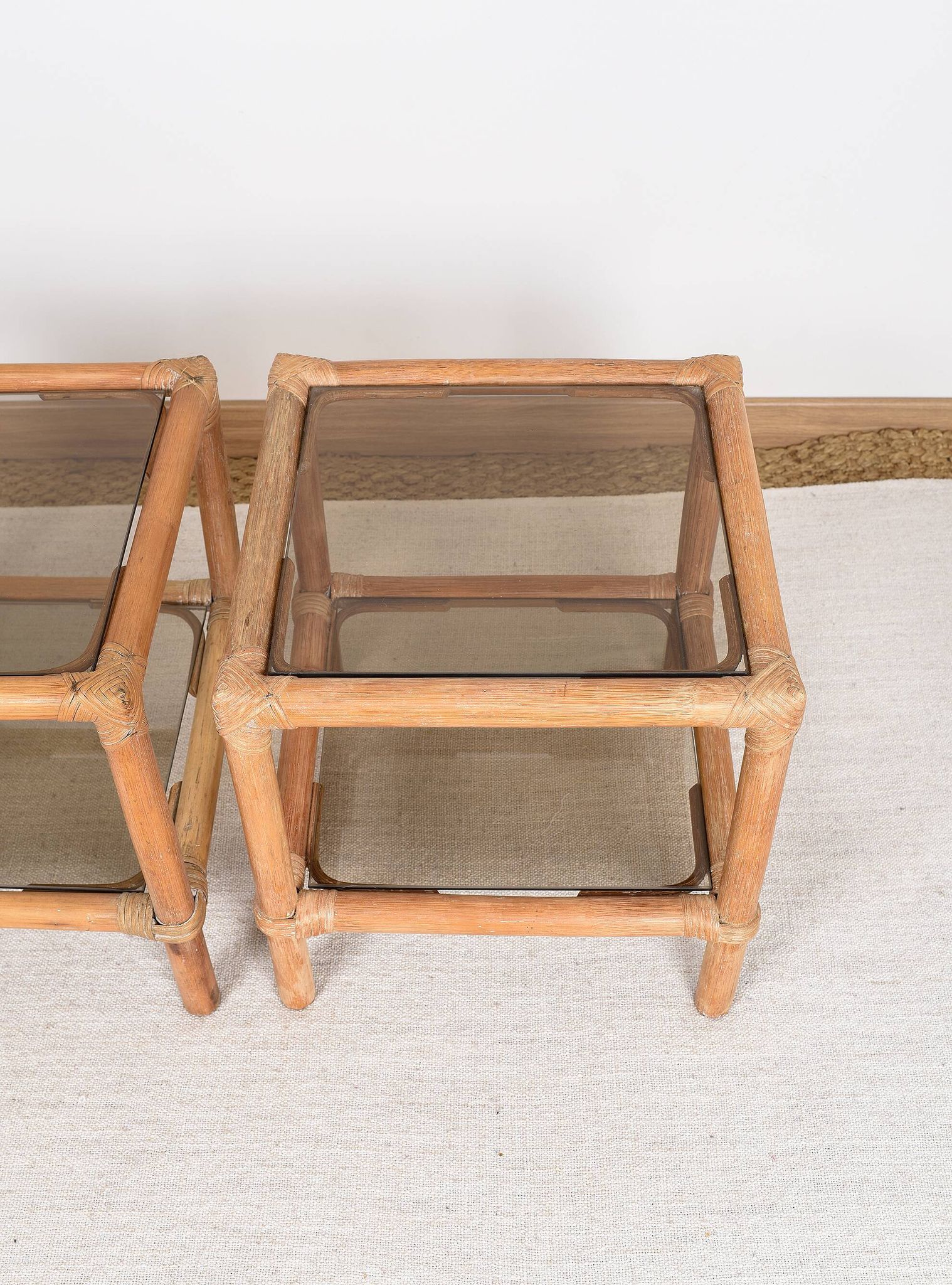 Pair of bedside tables or side tables, in rattan and smoked glass
