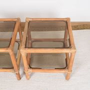 Pair of bedside tables or side tables, in rattan and smoked glass