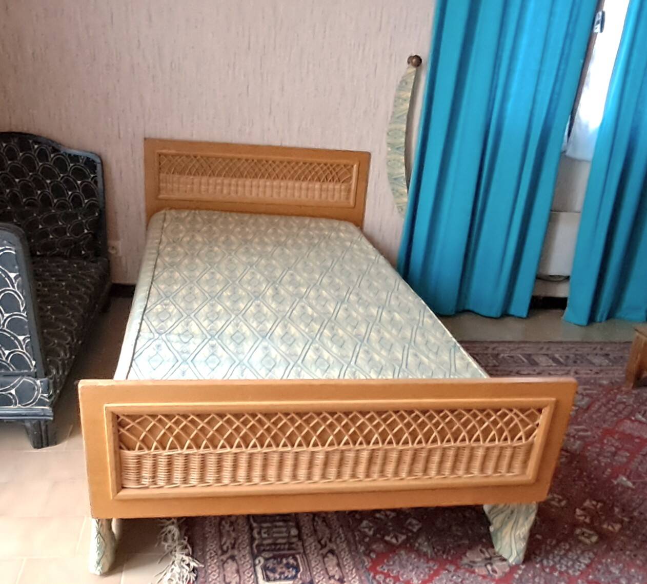 Vintage 1970s single rattan bed in blond wood