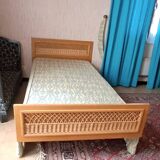 Vintage 1970s single rattan bed in blond wood