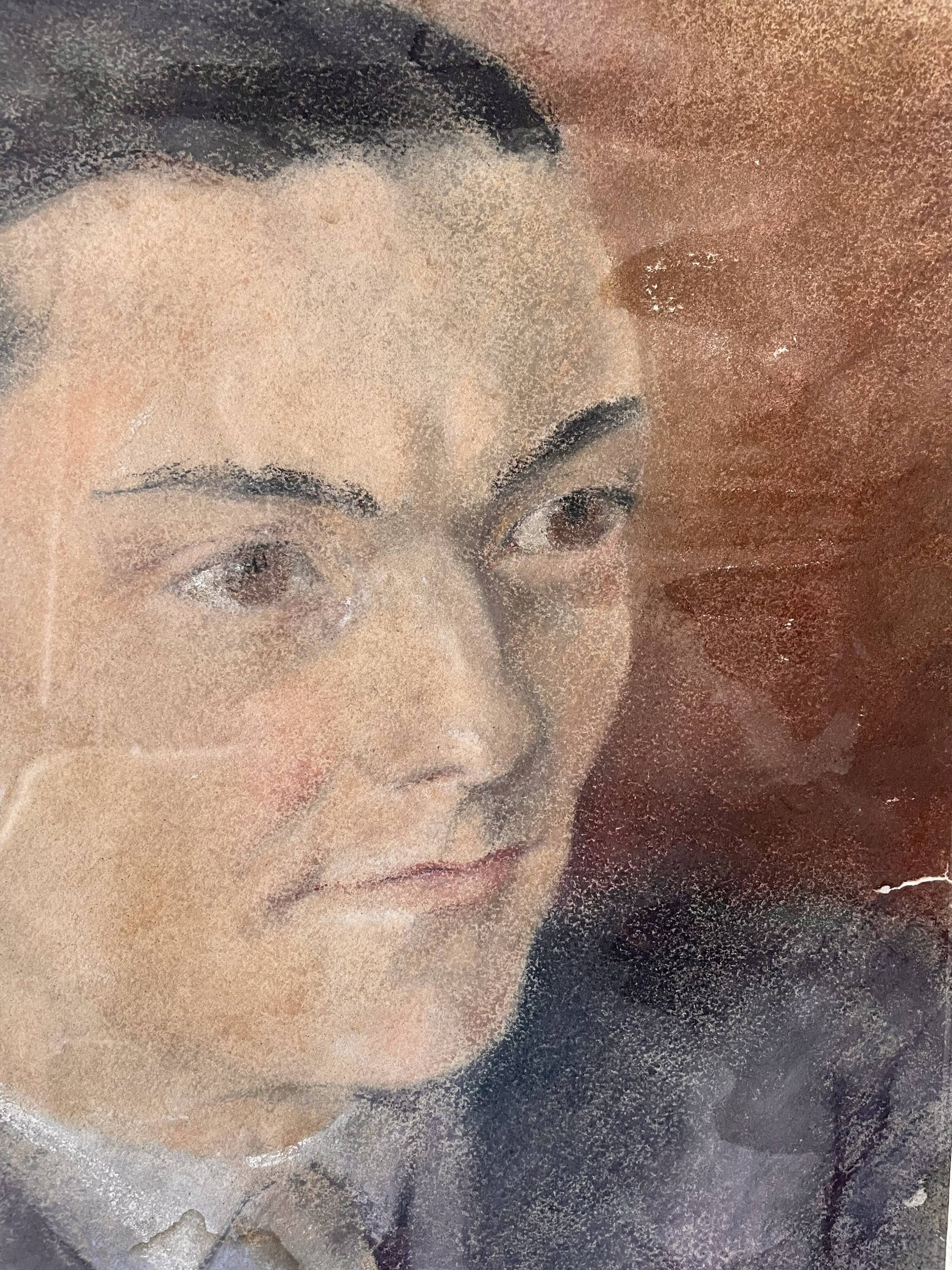 Portrait of a man in pastel under glass, signed, early 20th century.