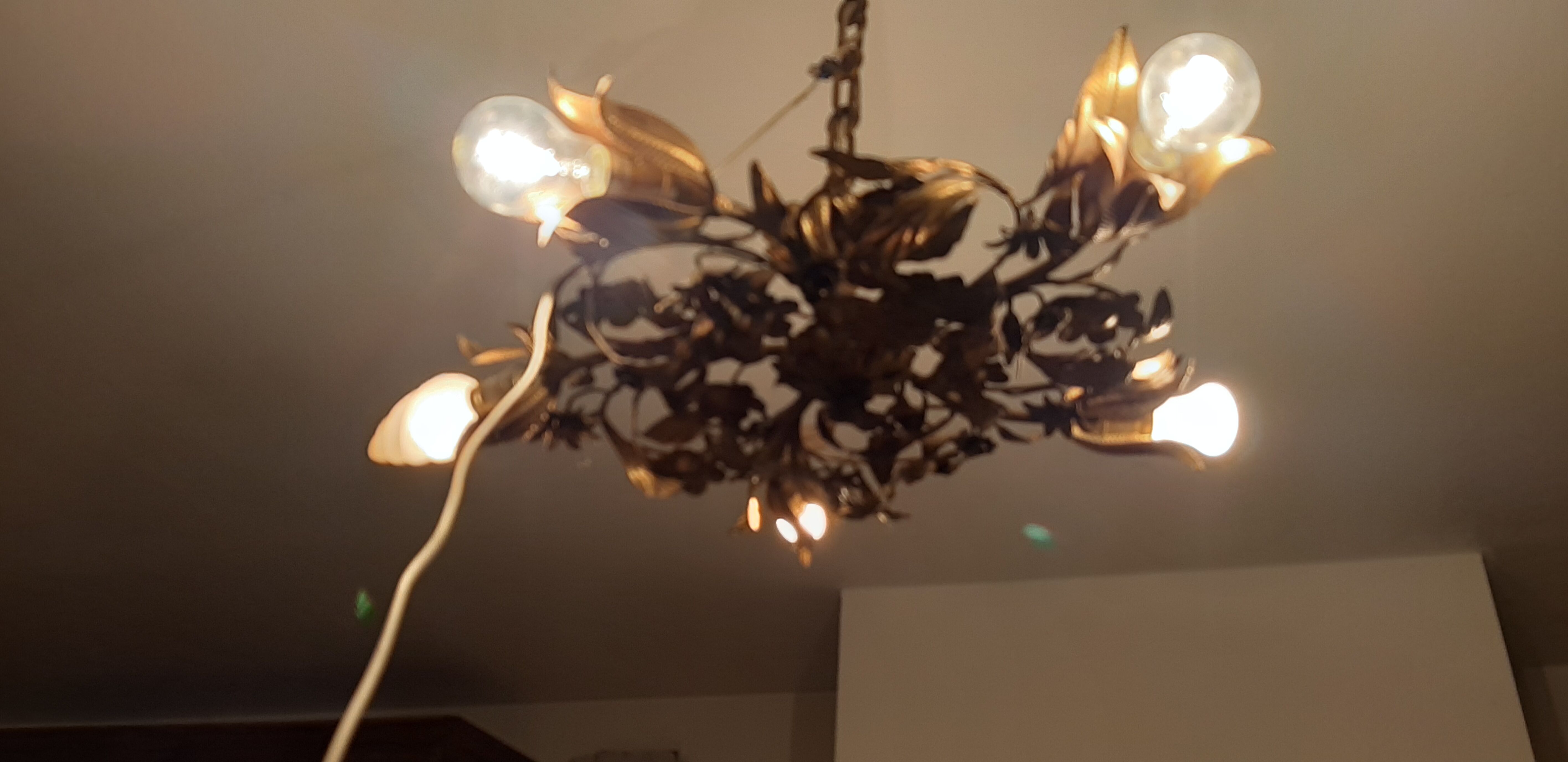 Vintage chandelier in gilded metal