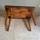 Mid-century coffee table with tapered legs.