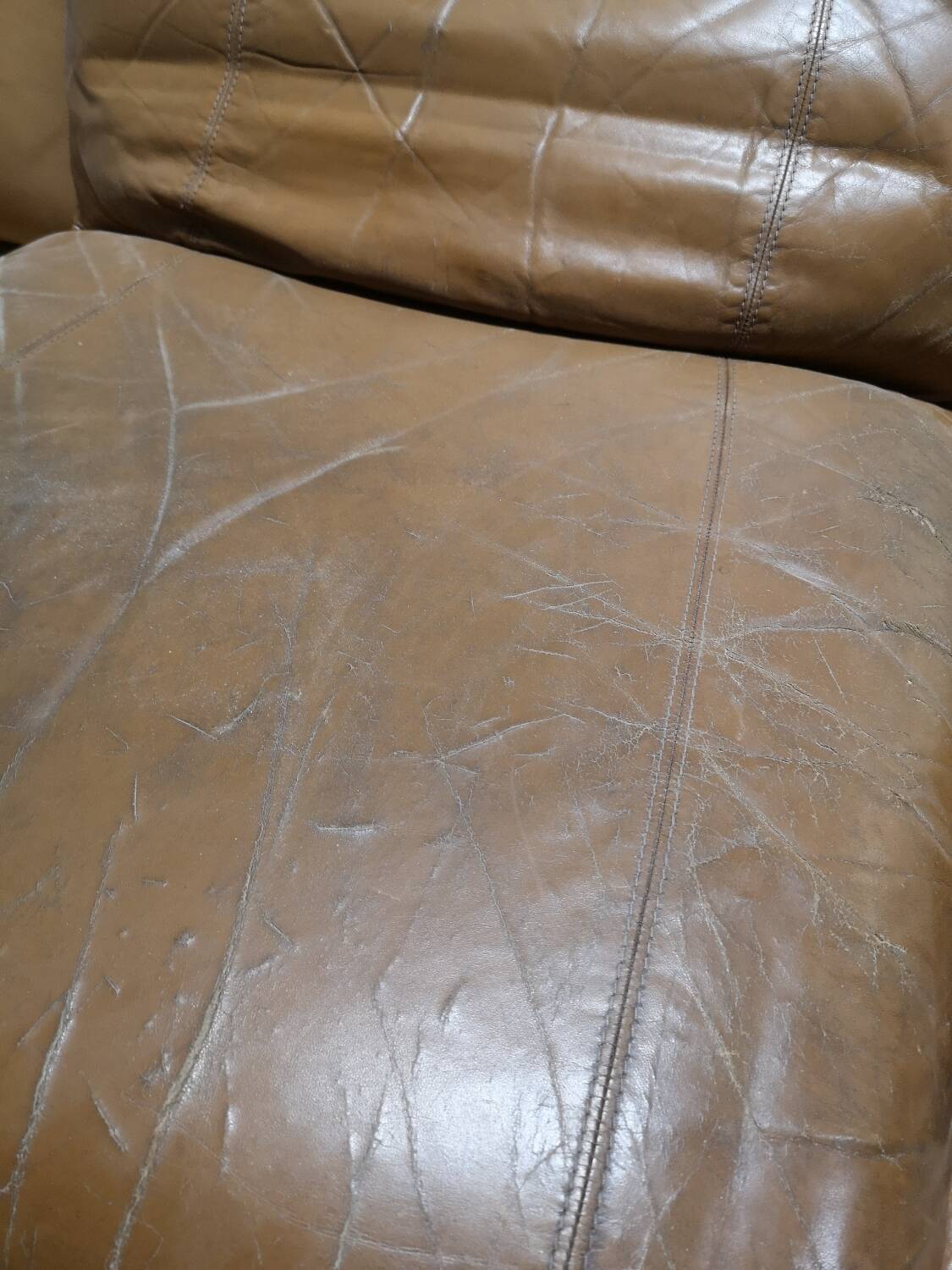 70s lounge chair in camel leather