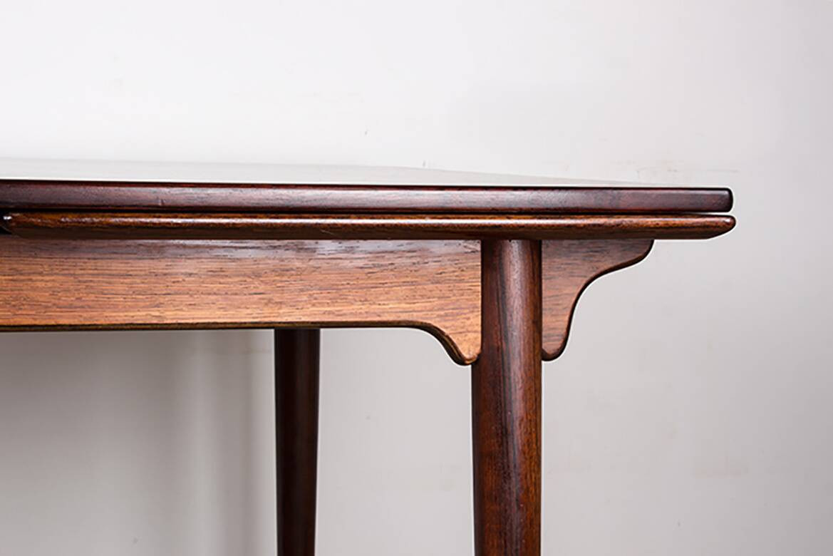 Danish extendable dining table in rosewood, model 54 by Gunni Omann