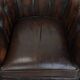 Brown Chesterfield armchair made of cowhide leather in English style