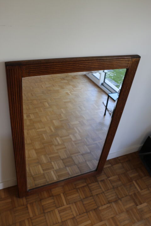Beveled mirror grooved wood