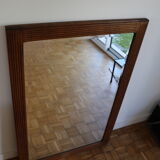 Beveled mirror grooved wood