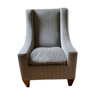 Fauteuil gris clair réalisé par un artisan