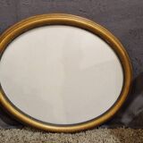 Golden oval frame