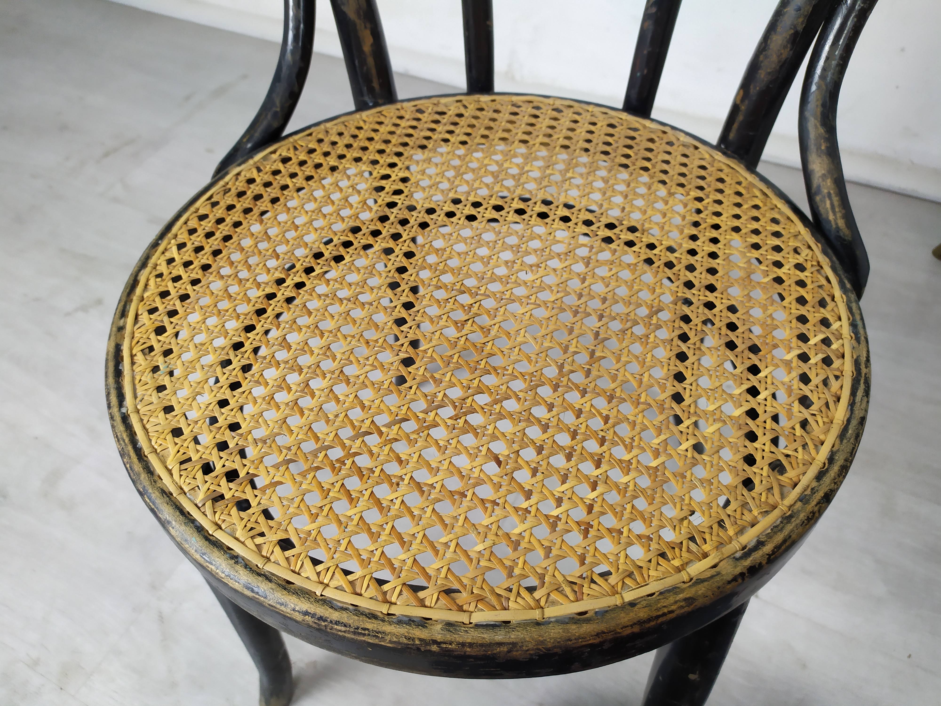 Black canned bistro chairs