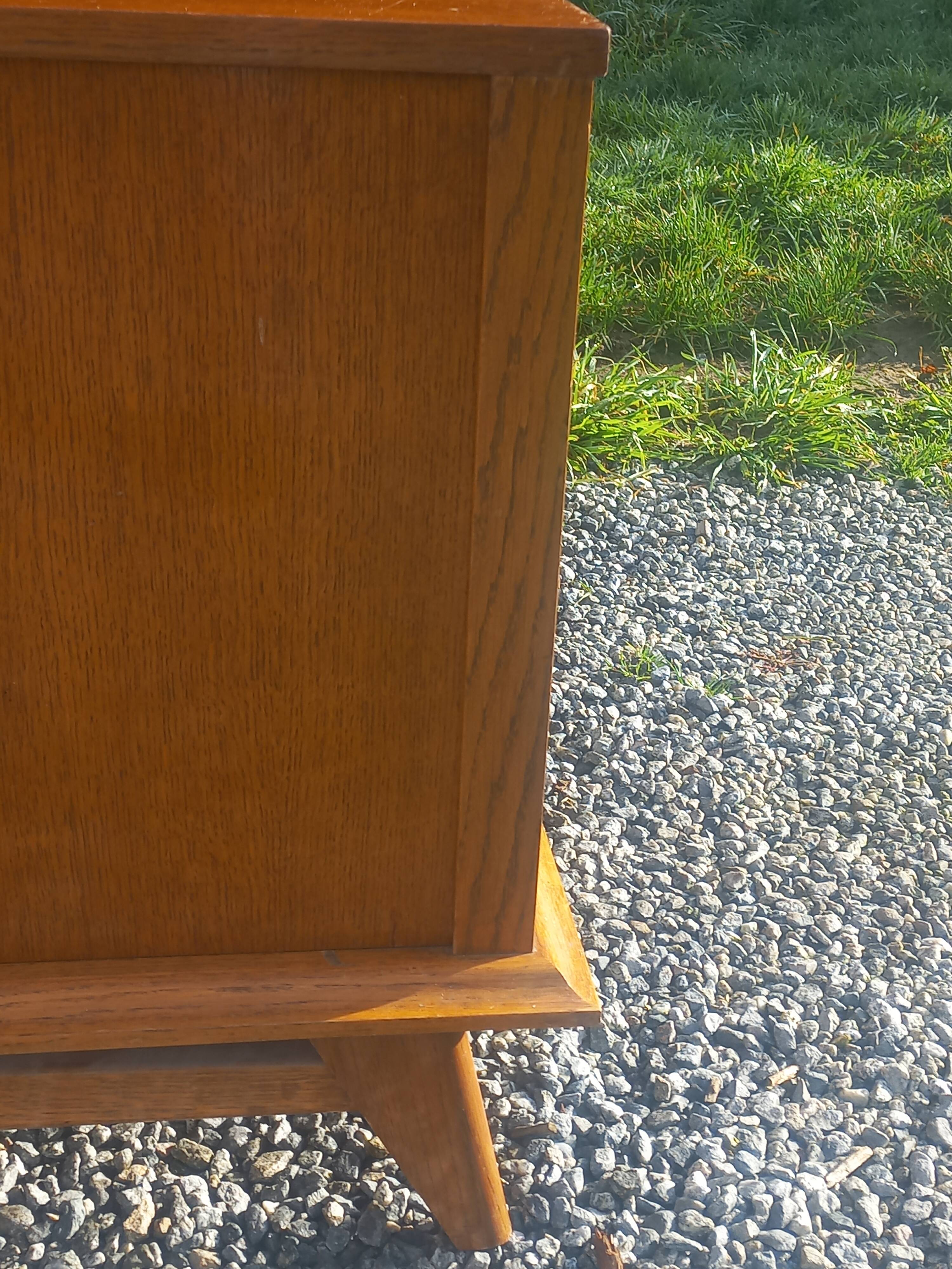 Vintage oak sideboard with splayed legs from the 1950s.