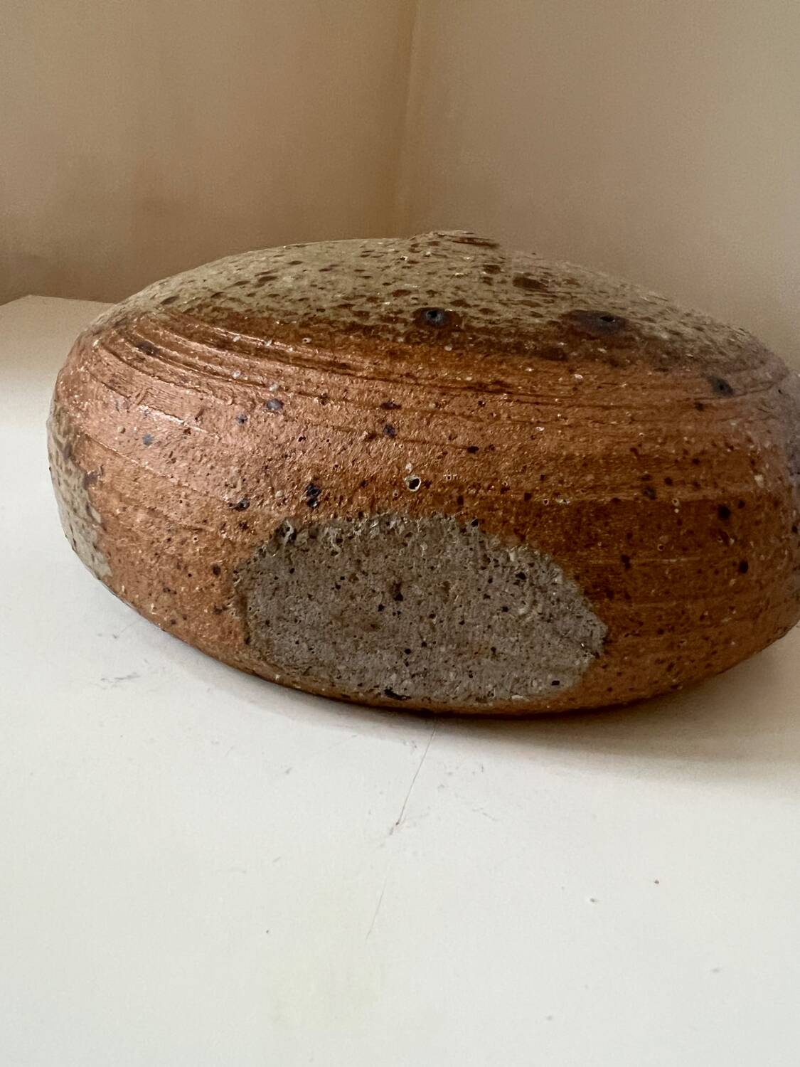 Vintage round, flat-bottomed stoneware bud vase