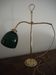 Desk lamp in brass with a swan neck and green opaline glass.
