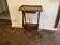 Nightstand in the shape of a lyre.
